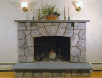 Fireplace in Stamford, CT with a symmetrical mosaic pattern.