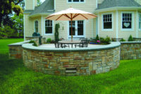 In Redding, CT, this spacious patio was built for outdoor entertaining and family gatherings. Note the rockface bluestone cap to the sitting wall constructed of brown fieldstone. 