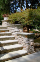 Chiseled rockface edges on the bluestone treads and bluestone caps, add a distinguished and elegant feel to these entry steps in New Canaan, CT.
