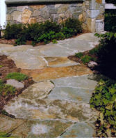 In South Salem, NY, this irregular fieldstone path set in cement wends through as simple perennial garden. 
