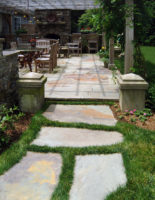 This irregular fieldstone path in Westport made of large stones set in the lawn beckons the walker for a leisurely stroll. 