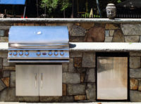 In Westport, CT, we designed and built this outdoor kitchen area with a large 48” grill with storage cabinet and an outdoor stainless-steel refrigerator. 