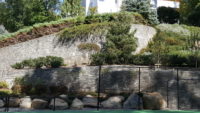 A long-time client wanted to add a tennis court to their property in Stamford, CT and asked us to incorporate it into the existing landscape which included ontinuation of an existing stone wall (our previous work).